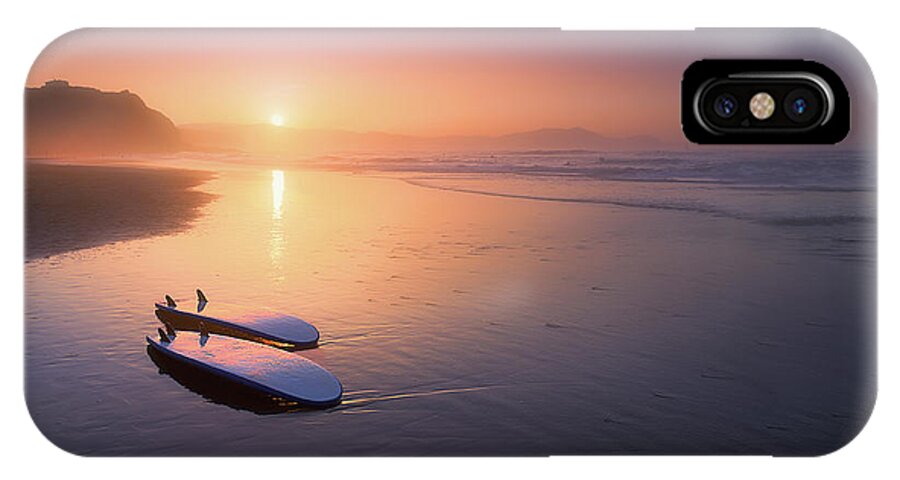 Surfboard iPhone X Case featuring the photograph Sopelana beach with surfboards on the shore by Mikel Martinez de Osaba