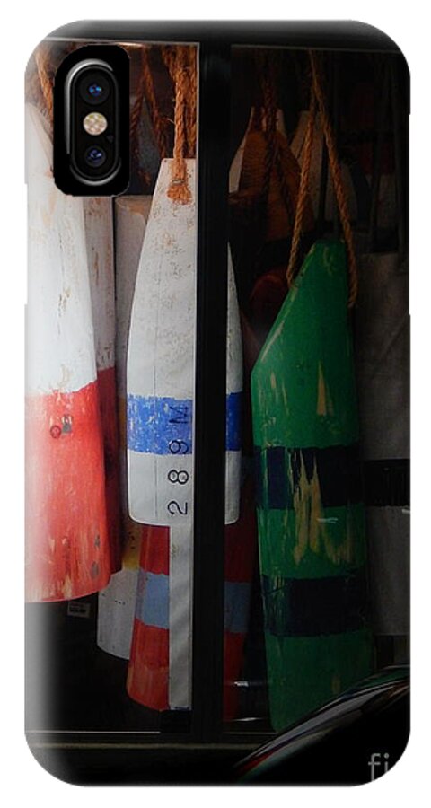 Buoys Displayed Side By Side Inside A Display Window In Downtown Key West .evening iPhone X Case featuring the photograph Window Buoys key West by Priscilla Batzell Expressionist Art Studio Gallery