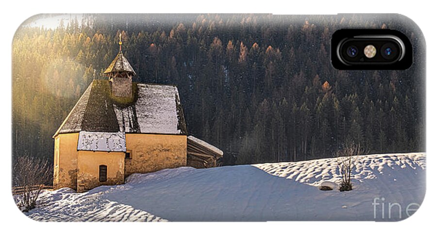 Mountain Landscape iPhone X Case featuring the photograph Mountain Landscape, Panoramic Snow Slope With Church In Winter Day With Sun Flare And Lens Flare by Luca Lorenzelli