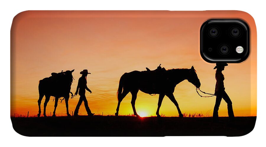Cowgirls Silhouette Horses Sunset Sunrise Twilight Horizon Landscape Beautiful Sexy Sky Women Two Pair Girls Cowboys Rural Ranch Countryside Havre Montana Country Evening Saddle Outdoors Beauty Nature Sun Sunlight Orange American West Side View Yellow Dusk Dawn Leading Harness Halter Walking Agriculture Guest Ranch Recreation Femininity Young Feminine Legs Bright Back Lit Horizon Over Land Western West Great Plains Equine Quarter Horse Best iPhone 11 Case featuring the photograph Off to the Barn by Todd Klassy