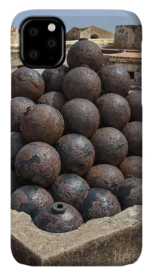 Artillery iPhone 11 Case featuring the photograph Stack Of Cannon Balls At Castillo San Felipe Del Morro by Bryan Mullennix