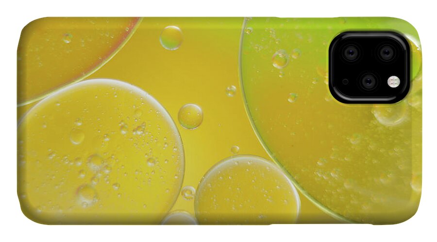 Water iPhone 11 Case featuring the photograph Oil and water bubbles by Andy Myatt