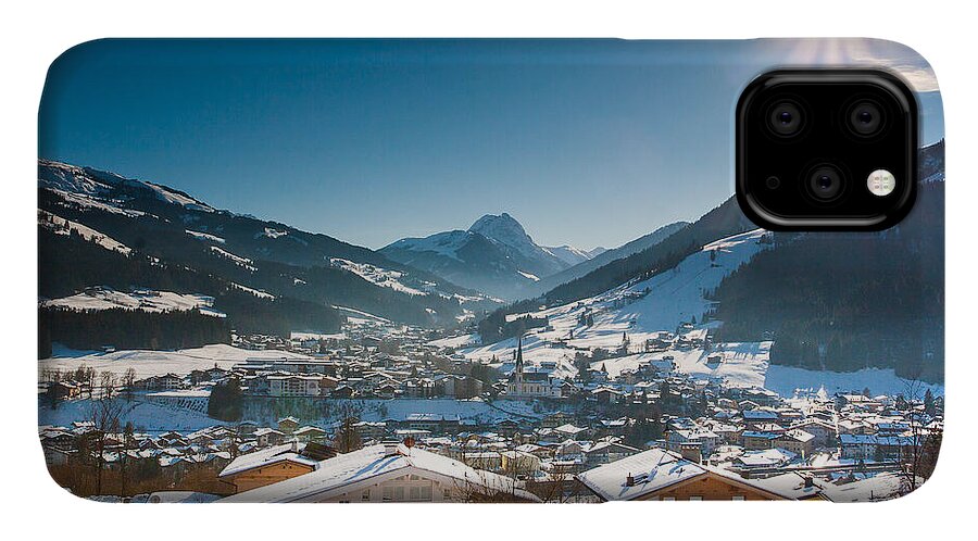 Austria iPhone 11 Case featuring the photograph Warm winter day in Kirchberg town of Austria by John Wadleigh