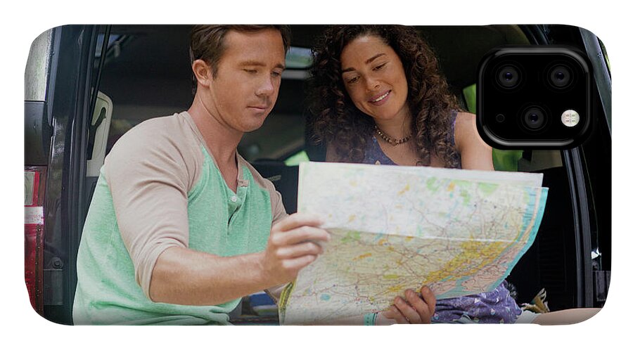 Friends Looking At Map While Sitting In Car Trunk iPhone 11 Case