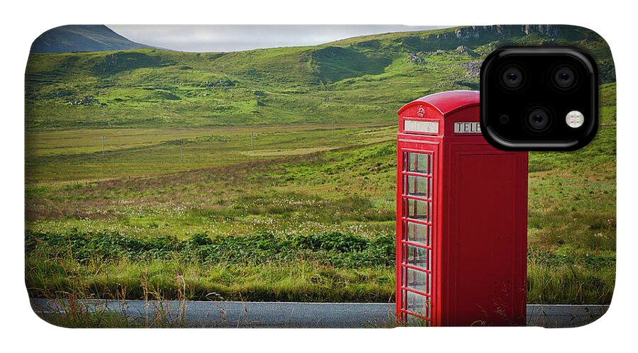 Bench iPhone 11 Case featuring the photograph Typical red English telephone box in a rural area near a road. by Joaquin Corbalan
