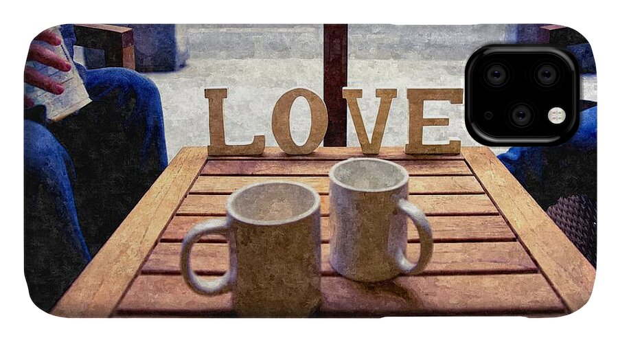 Aroma iPhone 11 Case featuring the photograph Word Love next to two cups of coffee on a table in a cafeteria, by Joaquin Corbalan