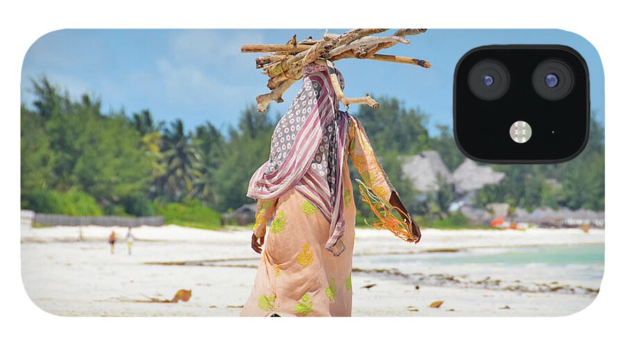 People iPhone 12 Case featuring the photograph African Girl With A Bundle Of Reeds On by Volanthevist