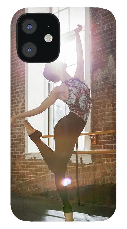 Ballet Dancer iPhone 12 Case featuring the photograph Ballerina Performing Balance On Pointe by Nisian Hughes