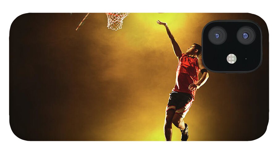 People iPhone 12 Case featuring the photograph Basketball Player Jumping With Glowing by Stanislaw Pytel