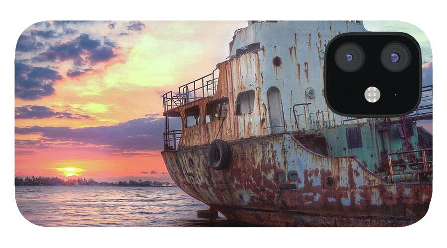 Tranquility iPhone 12 Case featuring the photograph Derelict Ship At Sunset by Onny Carr