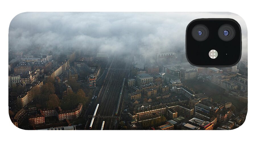 Train iPhone 12 Case featuring the photograph Elevated View Of City And Train Line In by Gary Yeowell