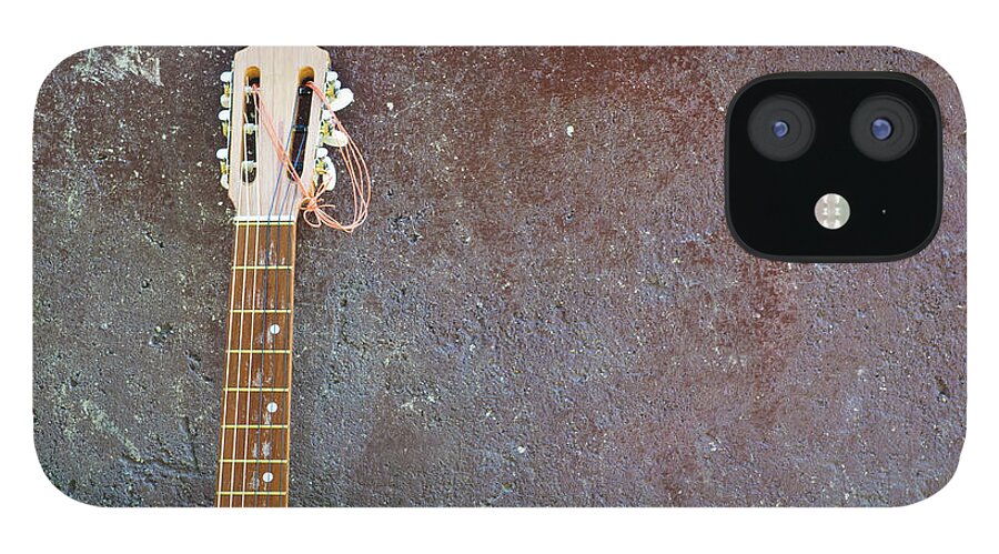 Rock Music iPhone 12 Case featuring the photograph Lonesome Guitar Leaning On Wall by Mac99