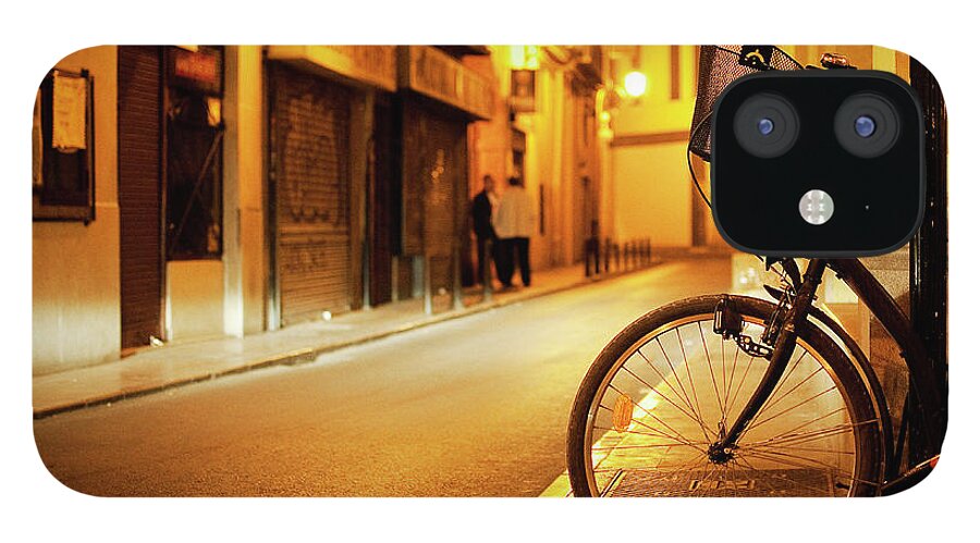 Outdoors iPhone 12 Case featuring the photograph Nigh Bike Wheels by Manuel Orero Galan