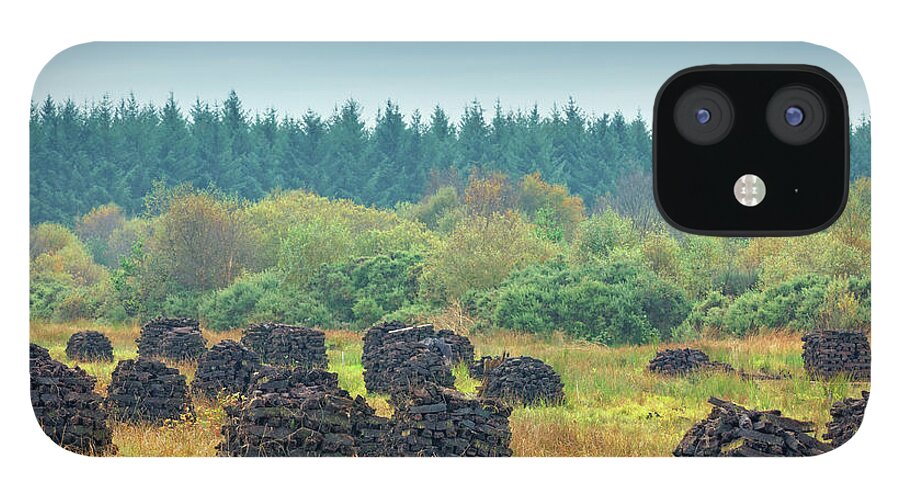 Outdoors iPhone 12 Case featuring the photograph Peat Stacks In Ireland by Mammuth