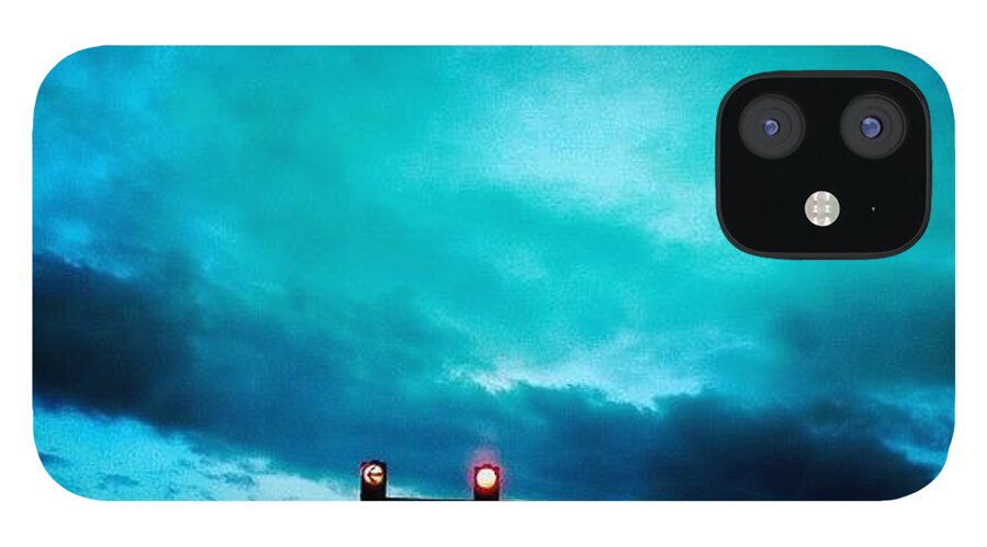 Blue iPhone 12 Case featuring the photograph Red traffic lights and dark blue sky by Matthias Hauser