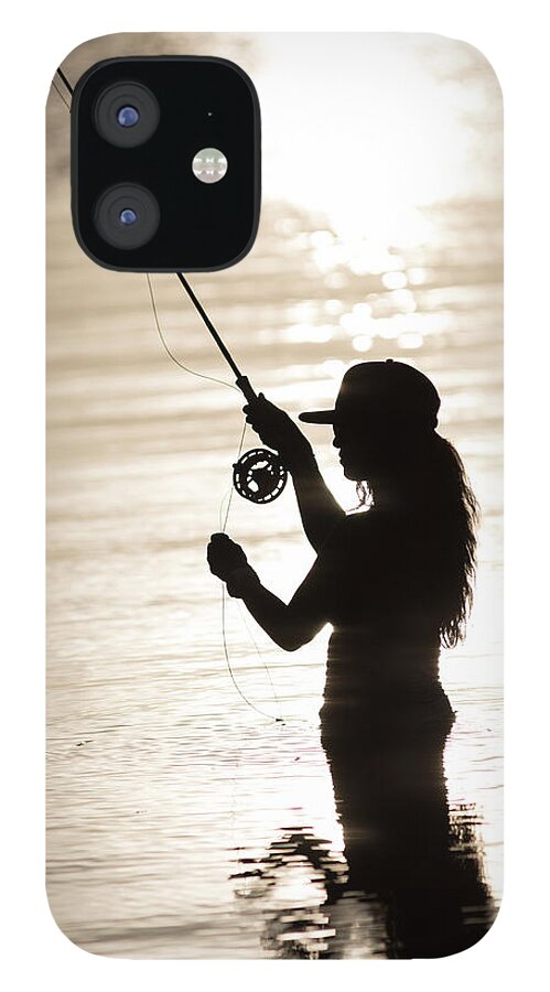 Silhouette Of Woman Fly-fishing iPhone 12 Case by Chris Ross