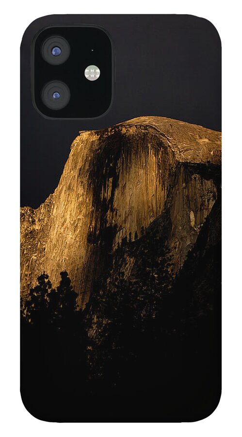 Scenics iPhone 12 Case featuring the photograph The Last Rays Of Sunset Illumine The by Kyle Sparks