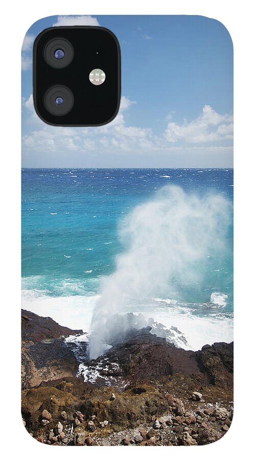 Honolulu iPhone 12 Case featuring the photograph Water Sprays Out Of A Blowhole On The by Brandon Tabiolo / Design Pics