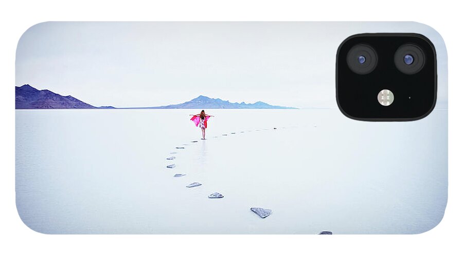 Scenics iPhone 12 Case featuring the photograph Woman On Stone Pathway In Lake With by Thomas Barwick