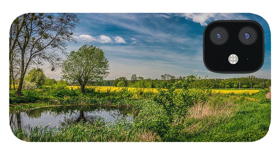 Field iPhone 12 Case featuring the photograph Little pond near a rapeseed field by Dmytro Korol