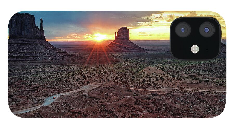 Monument Valley iPhone 12 Case featuring the photograph Sunset at Monument Valley Navajo Tribal Park Three Mittens Arizona by Silvio Ligutti