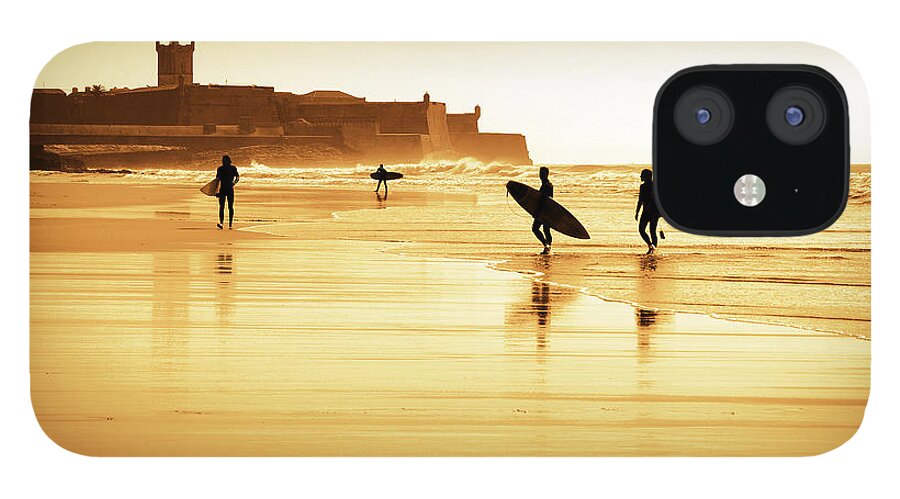 Action iPhone 12 Case featuring the photograph Surfers silhouettes by Carlos Caetano