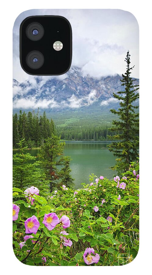 Wild Rose iPhone 12 Case featuring the photograph Wild roses and mountain lake in Jasper National Park by Elena Elisseeva