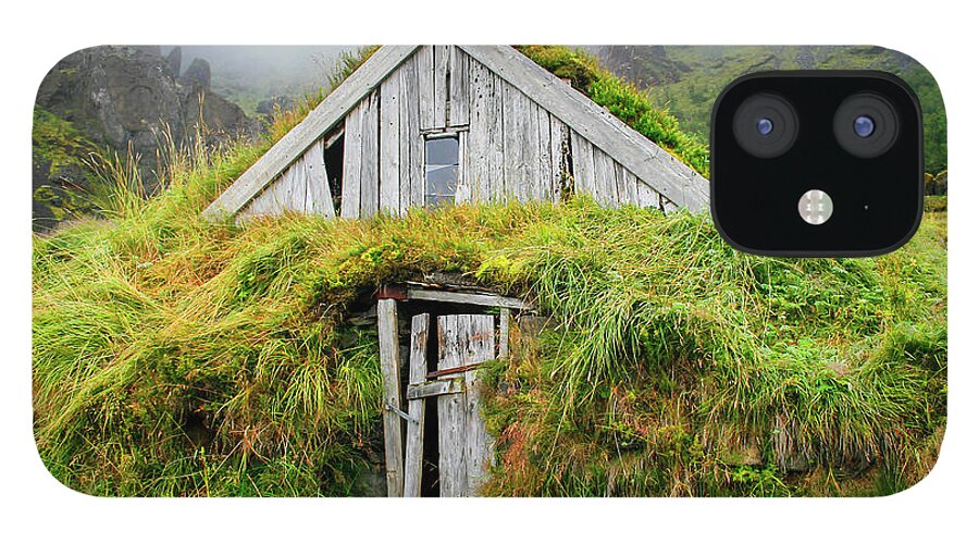 Iceland iPhone 12 Case featuring the photograph Wooden house isolated with grass in Iceland by Patricia Hofmeester