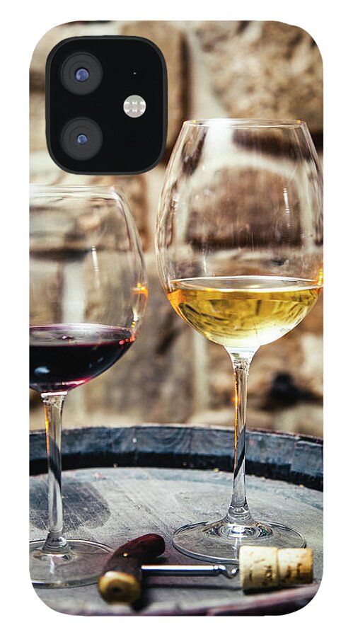 Alcohol iPhone 12 Case featuring the photograph Two Glasses Of Red And White Wine In #1 by Piranka