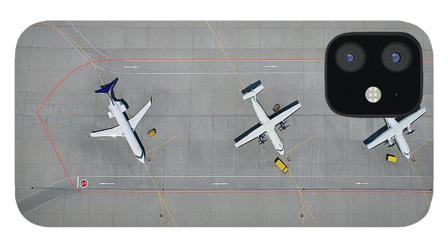 Shadow iPhone 12 Case featuring the photograph Aerial View Of Three Parked Airplanes by Stephan Zirwes