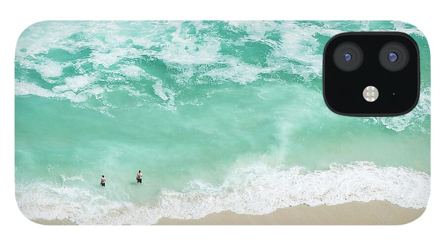 Scenics iPhone 12 Case featuring the photograph Bathers Swimming On Isolated Beach by Peter Chadwick