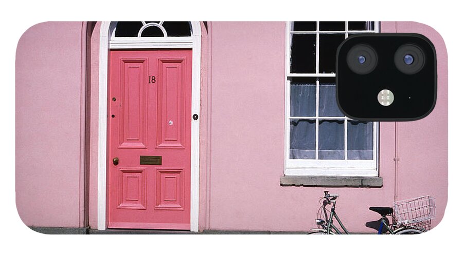 Shadow iPhone 12 Case featuring the photograph Bicycle Leaning Against Pink House by David Tomlinson