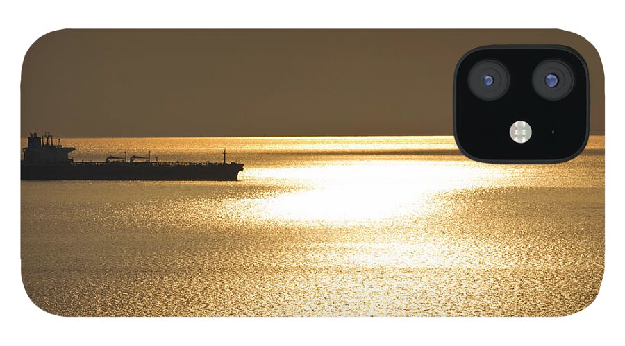 Long iPhone 12 Case featuring the photograph Cargo Ship In The Sunset by Gaspr13