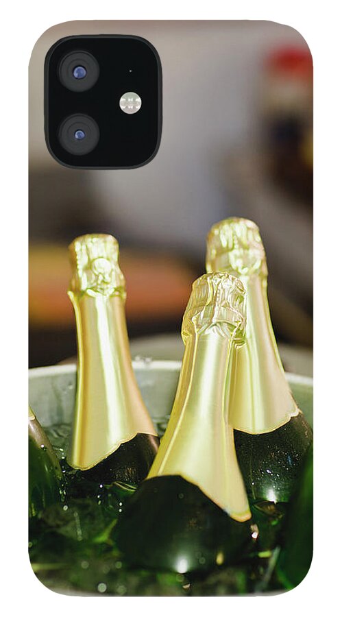 Celebration iPhone 12 Case featuring the photograph Close Up Of Bucket Of Champagne by Hybrid Images