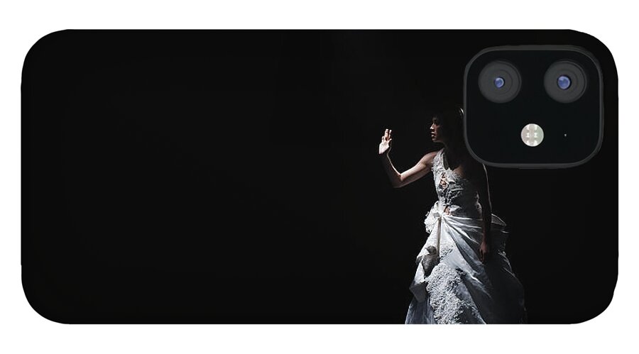 People iPhone 12 Case featuring the photograph Dancer In Gown Under Spotlight On Stage by Patrik Giardino
