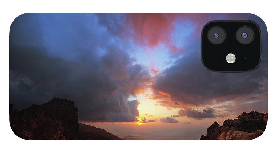 Tyrrhenian Sea iPhone 12 Case featuring the photograph Dramatic Cloudscape Over Rocky Coastline by Akrp