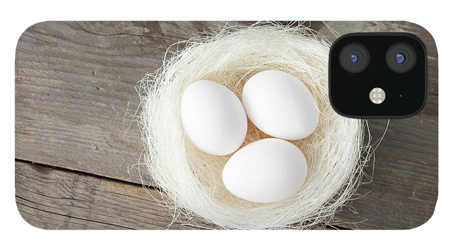 Bavaria iPhone 12 Case featuring the photograph Eggs In Nest On Wooden Counter by Stefanie Grewel