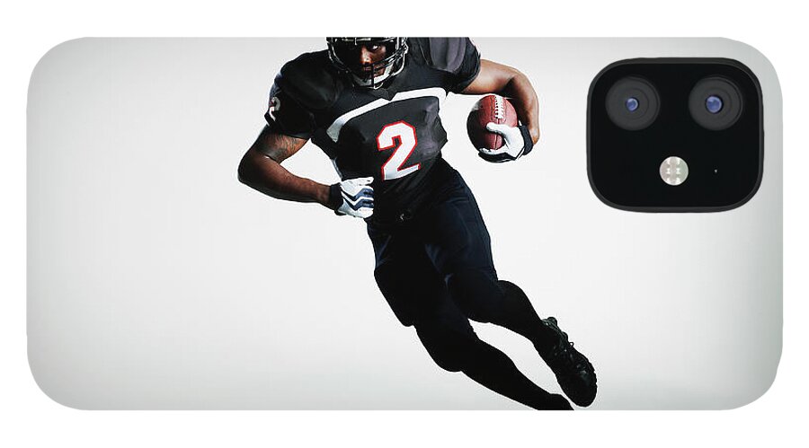 American Football Uniform iPhone 12 Case featuring the photograph Football Player Running With Ball by Thomas Barwick