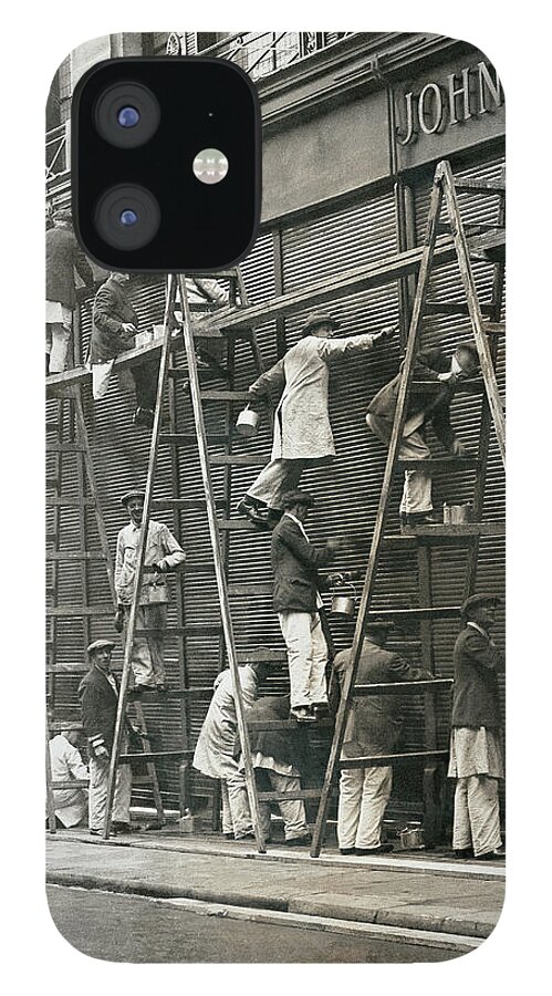 Photography iPhone 12 Case featuring the photograph Group Of Painters On Ladders by Digital Vision.