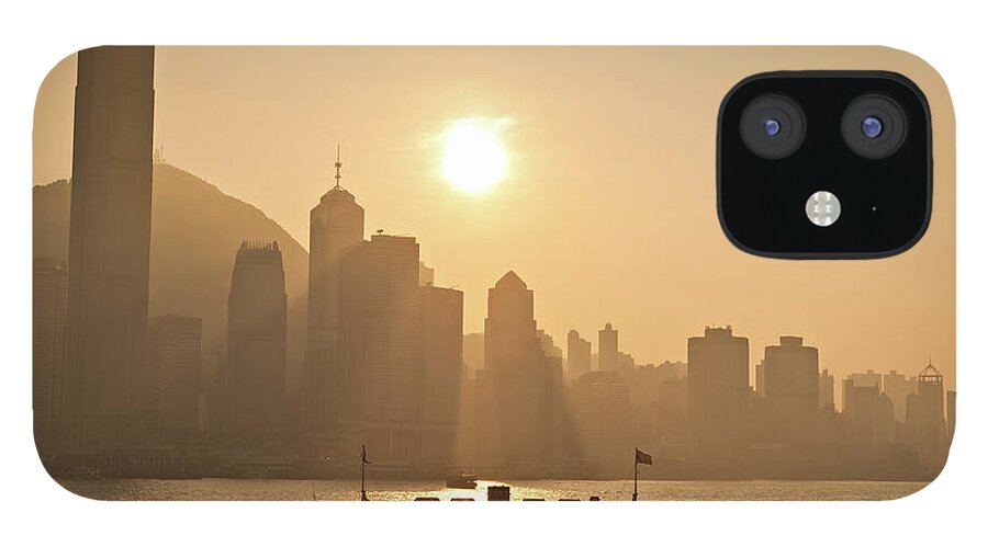 Water's Edge iPhone 12 Case featuring the photograph Hong Kong Harbour Sunset Star Ferry by Fotovoyager