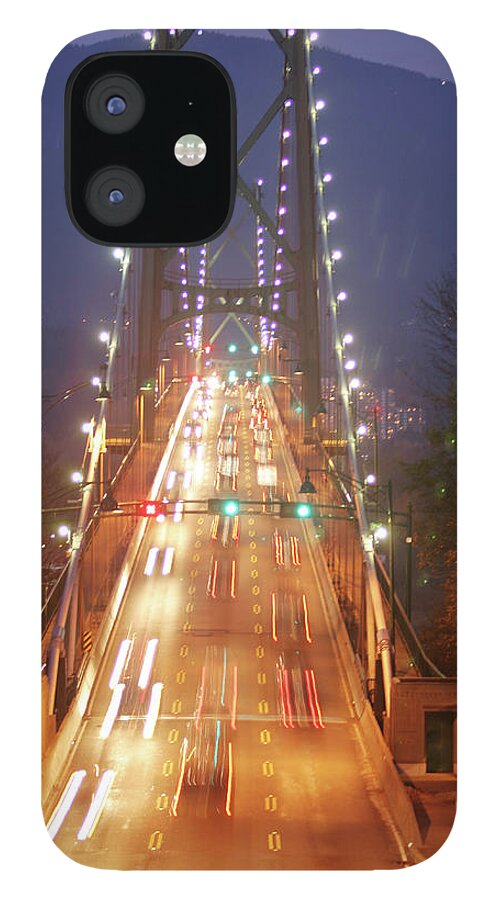 Blurred Motion iPhone 12 Case featuring the photograph Lions Gate Bridge Early Evening by Lonely Planet