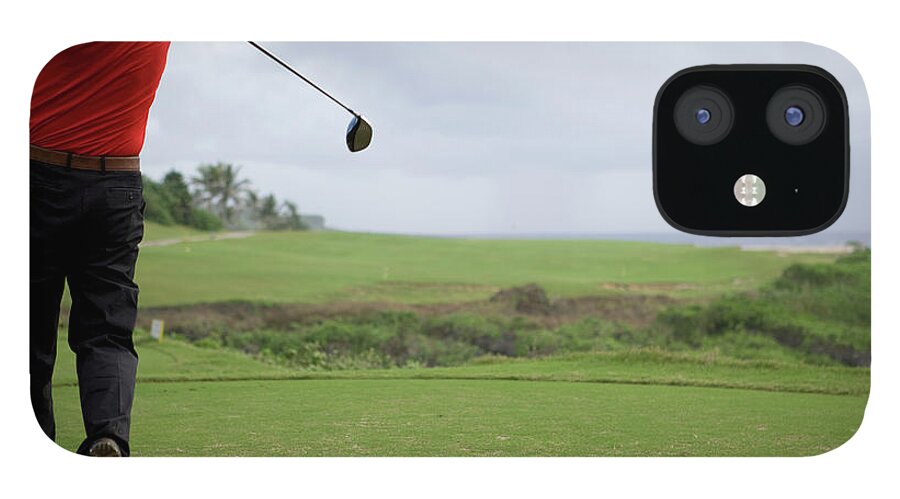 Grass iPhone 12 Case featuring the photograph Man Swinging Golf Club, Rear View by Flashfilm