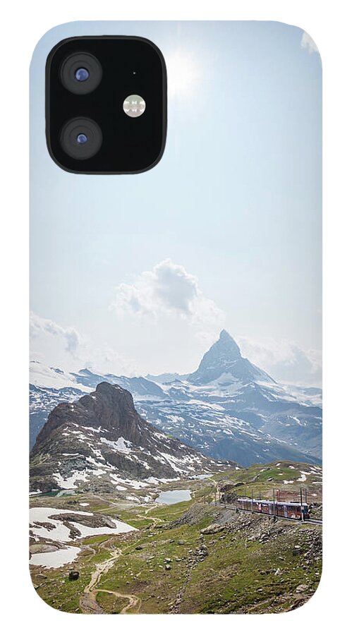 Scenics iPhone 12 Case featuring the photograph Matterhorn Railway With Train Zermatt by Matteo Colombo