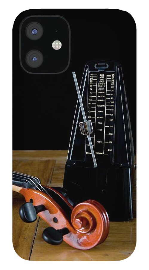 Violin Scroll iPhone 12 Case featuring the photograph Metronome And Violin On Wooden Table by Junior Gonzalez