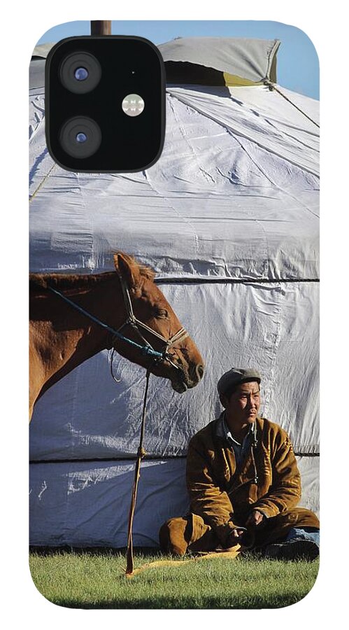 Horse iPhone 12 Case featuring the photograph Mongolian Herder Sits Outside Ger With by Timothy Allen