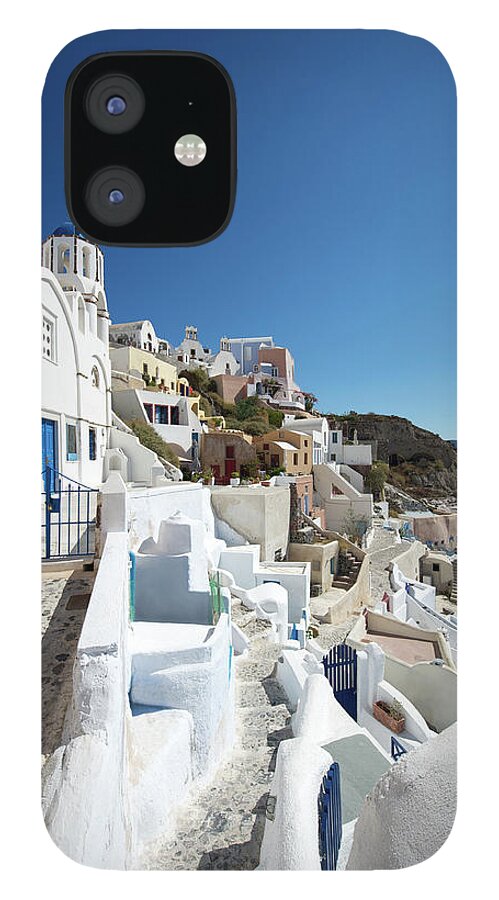 Steps iPhone 12 Case featuring the photograph Oia Hillside Village Santorini Blue Sky by Peskymonkey