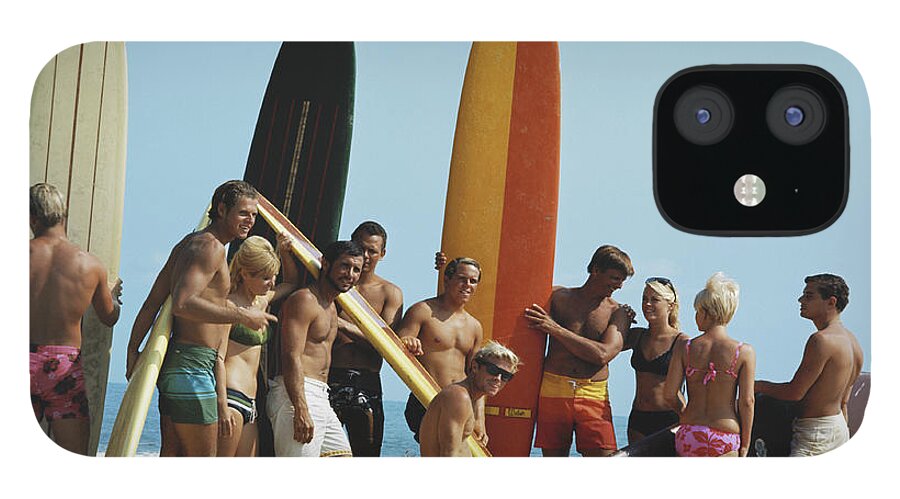 People iPhone 12 Case featuring the photograph People On Beach With Surf Board by Tom Kelley Archive