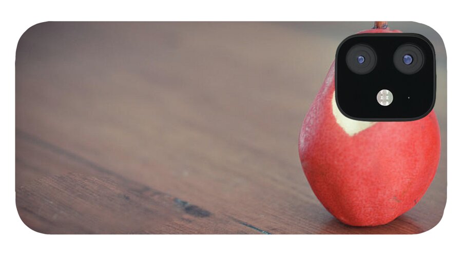 Wood iPhone 12 Case featuring the photograph Red Pear With Heart Shape Bit by Danielle Donders