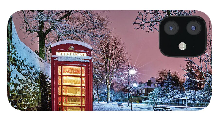 Snow iPhone 12 Case featuring the photograph Red Phone Box Covered In Snow by Photo By John Quintero