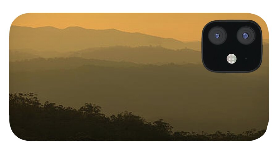Landscape iPhone 12 Case featuring the photograph Shapes of hills at sunset by Nicolas Lombard